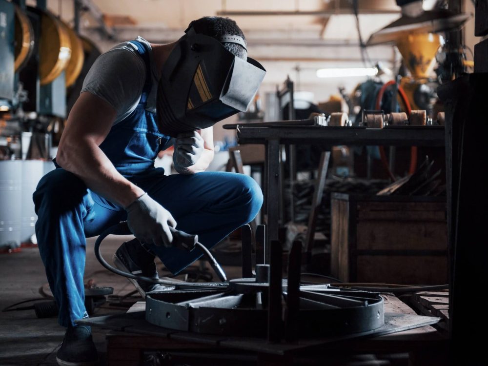 portrait-of-a-young-worker-at-a-large-metalworking-plant-the-welder-engineer-works-in-a-protective-1.jpg